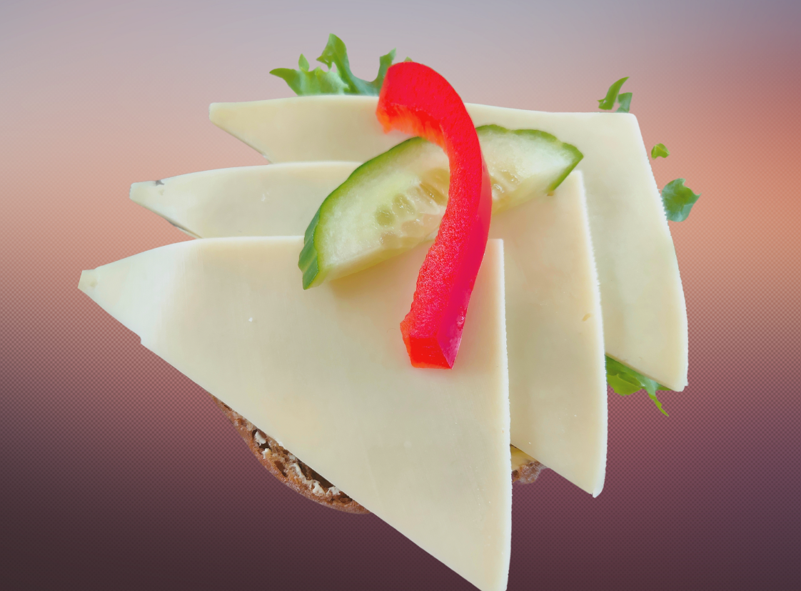 Rolls of dark Gouda cheese